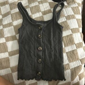 dark grey tank top with buttons on the front